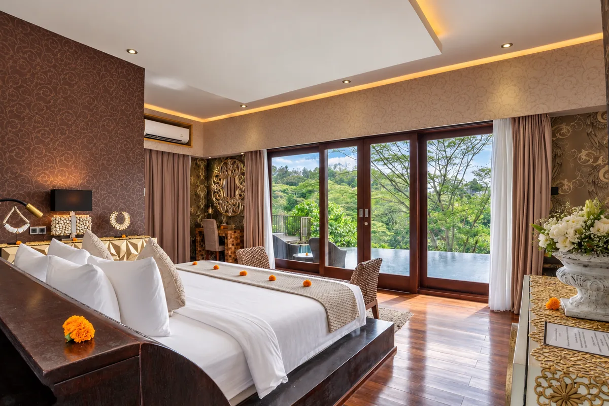 Twin beds in a warm-toned bedroom with timber flooring and glazed doors toward the pool