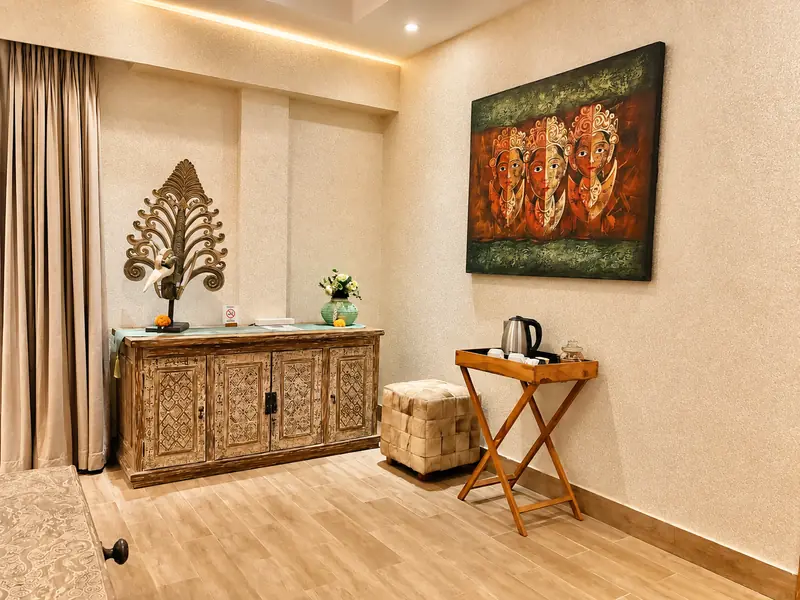 Red Room carved timber cabinet, decorative sculpture, local artwork, ottoman and kettle with cups