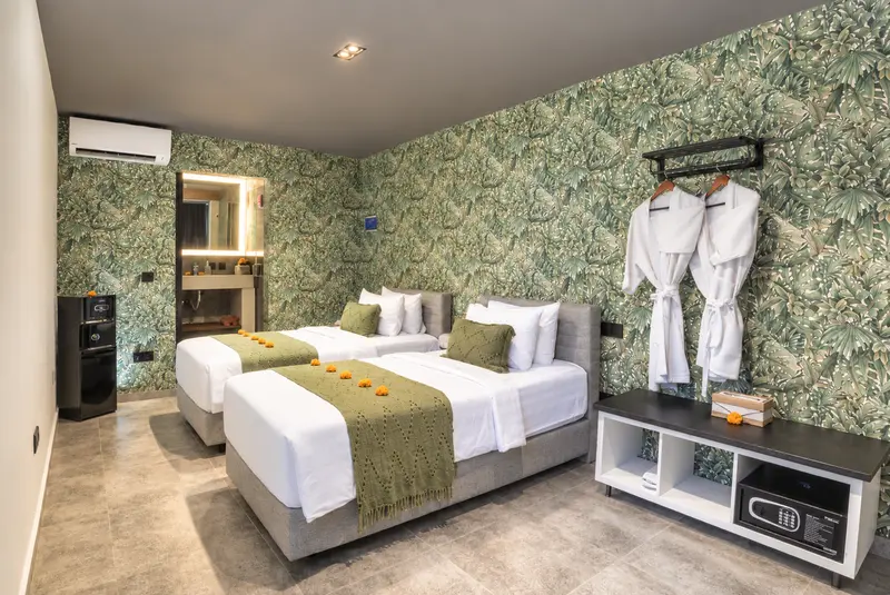 Full River Villa Room 3 view with twin beds, open hanging rail, low storage console, safe and air conditioning