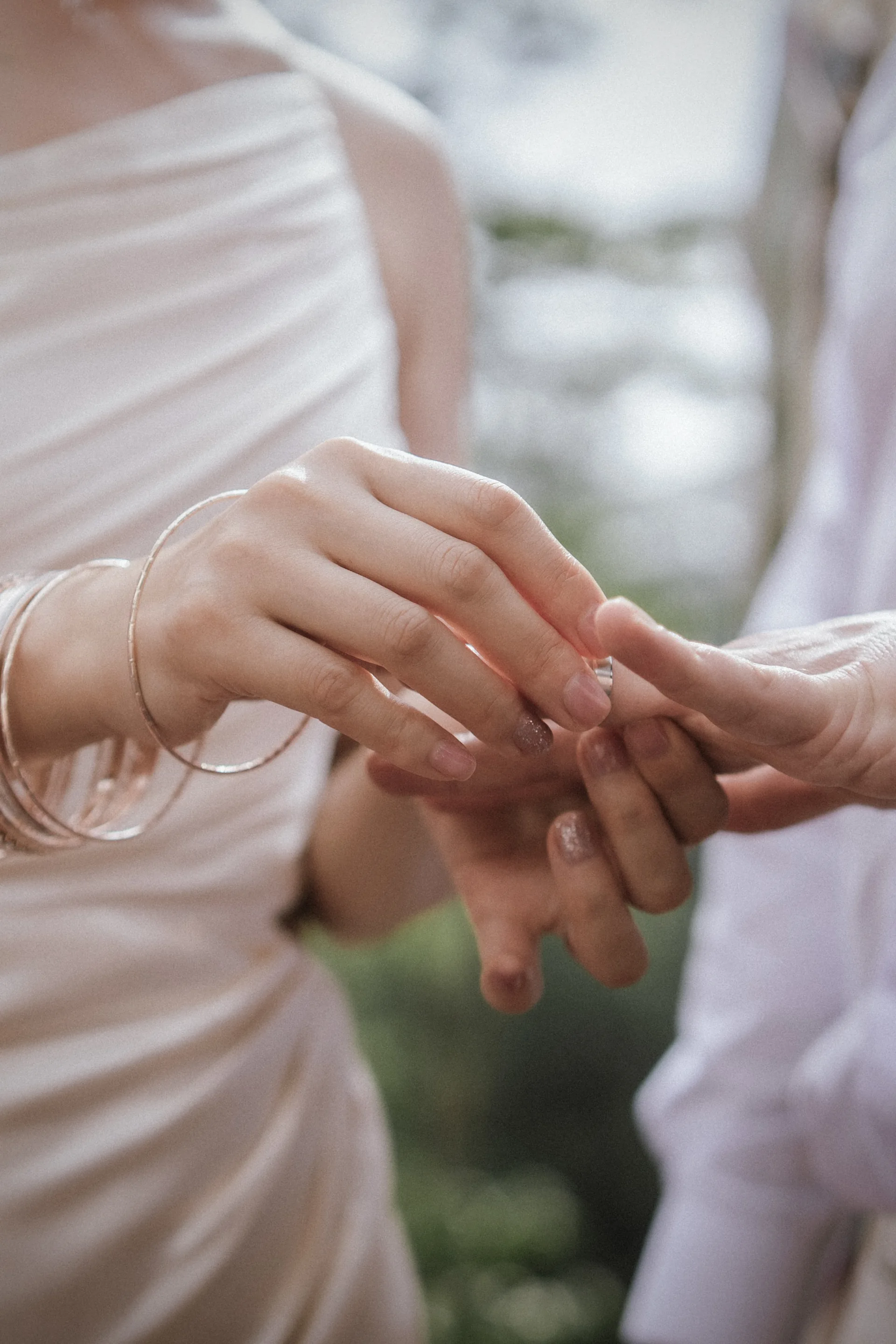 Close view of a couple exchanging a ring