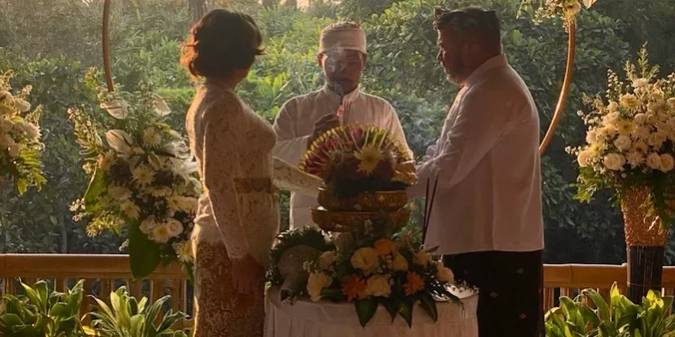 1 Bali destination wedding villa set up for a romantic beachfront ceremony